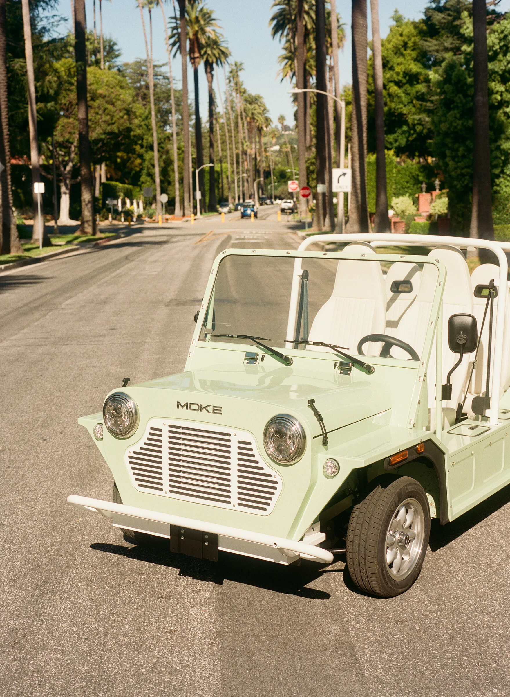 Mint Moke on a palm-lined California street