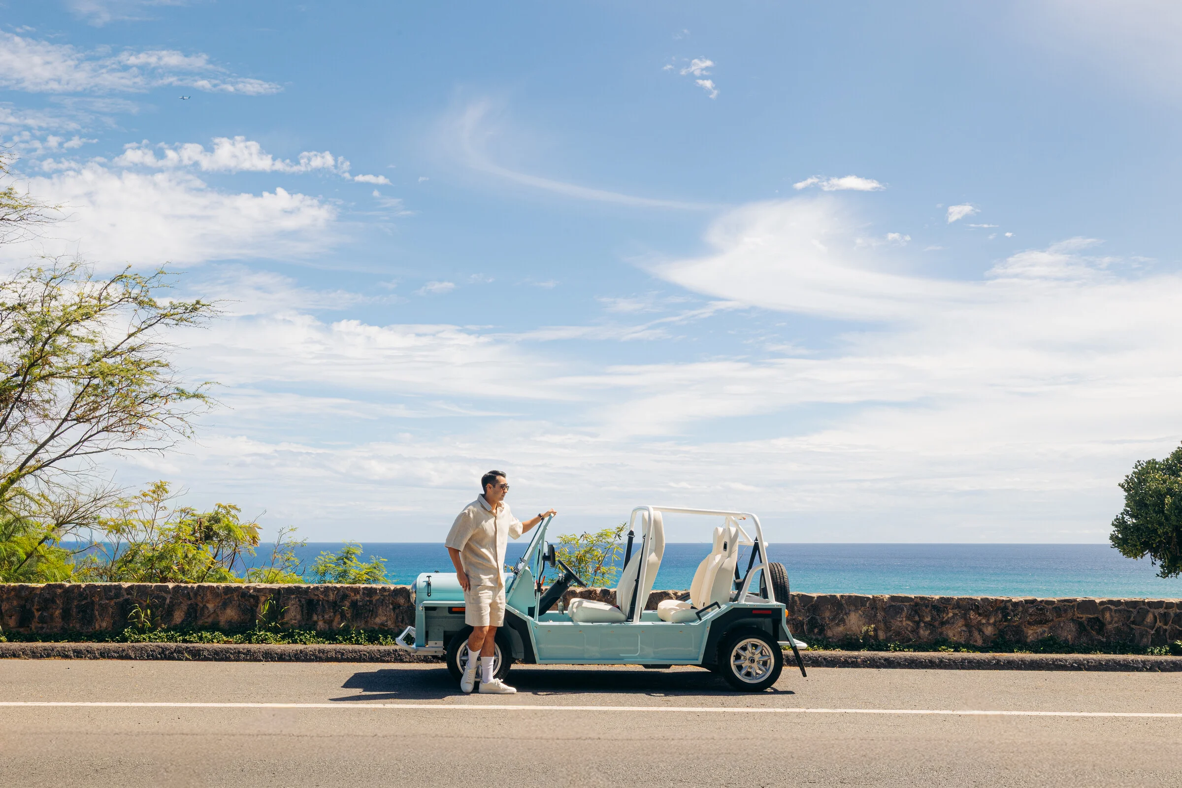 Blue Moke beside the Waikiki waterfront