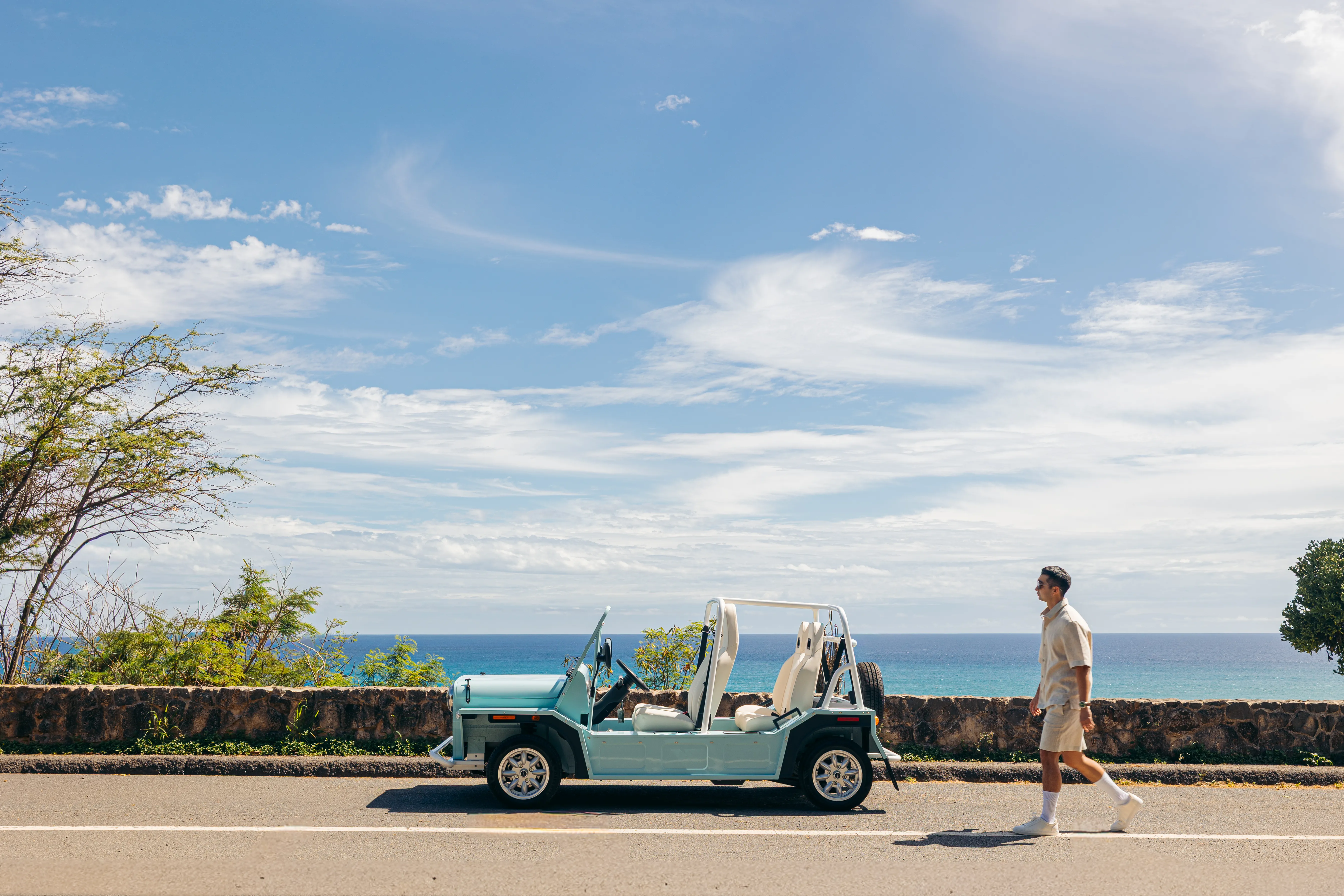 A Moke parked along the ocean wall on O‘ahu